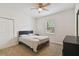 Bright bedroom with a double bed, carpet flooring, and ample closet space at 200 Southern Pecan Cir # 105, Winter Garden, FL 34787