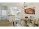 Dining area with glass table and chairs, adjacent to the kitchen at 200 Southern Pecan Cir # 105, Winter Garden, FL 34787