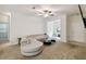 Open living room with sectional sofa and entryway view at 200 Southern Pecan Cir # 105, Winter Garden, FL 34787