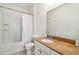 Clean bathroom with shower/tub combo and granite vanity at 200 Southern Pecan Cir # 105, Winter Garden, FL 34787