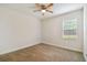Simple bedroom with ceiling fan and neutral decor at 200 Southern Pecan Cir # 105, Winter Garden, FL 34787