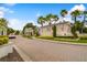Community entrance with signage and paved roadway at 200 Southern Pecan Cir # 105, Winter Garden, FL 34787