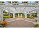 Beautiful brick patio with a water fountain and pergola at 200 Southern Pecan Cir # 105, Winter Garden, FL 34787