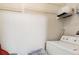 Laundry room with washer, dryer, and shelving for storage at 200 Southern Pecan Cir # 105, Winter Garden, FL 34787