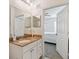 Modern bathroom with double sinks and a view of bedroom at 200 Southern Pecan Cir # 105, Winter Garden, FL 34787