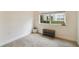Simple home office with window, carpet flooring, and a small bench at 200 Southern Pecan Cir # 105, Winter Garden, FL 34787