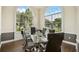 Elegant meeting room with glass table and leather chairs at 200 Southern Pecan Cir # 105, Winter Garden, FL 34787