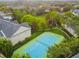 Aerial view of tennis court with surrounding green space at 200 Southern Pecan Cir # 105, Winter Garden, FL 34787