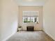 Bright home office with a window, carpet flooring and a small bench at 200 Southern Pecan Cir # 105, Winter Garden, FL 34787