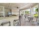 Outdoor community bar and seating area with granite counter tops at 200 Southern Pecan Cir # 105, Winter Garden, FL 34787