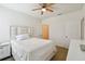 Light and airy bedroom with a queen-size bed and ceiling fan at 200 Southern Pecan Cir # 105, Winter Garden, FL 34787