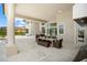 Spacious covered patio with outdoor dining and pool access at 4029 Isabella Cir, Windermere, FL 34786