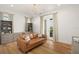 Bright office with hardwood floors, built-in shelving, and comfortable seating at 4029 Isabella Cir, Windermere, FL 34786