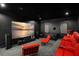 Home theater with large screen displaying scenic image, comfortable seating at 4029 Isabella Cir, Windermere, FL 34786