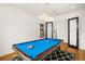 Well-lit game room featuring a pool table, hardwood floors, and modern lighting at 4029 Isabella Cir, Windermere, FL 34786
