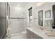 Modern bathroom with a large shower, marble vanity, and neutral color palette at 4029 Isabella Cir, Windermere, FL 34786
