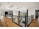 Open upper hallway with hardwood floors and views of the living room below at 4029 Isabella Cir, Windermere, FL 34786