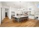 Gourmet kitchen with island, stainless steel appliances, and white cabinetry at 4029 Isabella Cir, Windermere, FL 34786