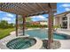 Relaxing pool and hot tub area with pergola at 4029 Isabella Cir, Windermere, FL 34786
