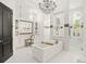 Elegant bathroom with a freestanding tub, walk-in shower, and double vanity at 4029 Isabella Cir, Windermere, FL 34786