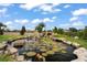 Serene backyard oasis with a koi pond and water feature at 4029 Isabella Cir, Windermere, FL 34786