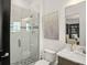 Modern bathroom with glass shower, marble vanity, and elegant decor at 4029 Isabella Cir, Windermere, FL 34786