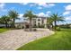Two-story luxury home with palm trees and a large driveway at 4029 Isabella Cir, Windermere, FL 34786