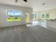 Bright and spacious living room with large windows and carpet flooring at 3696 Sagefield Dr, St Cloud, FL 34773