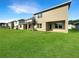 Newly built home with a spacious backyard and covered patio at 3696 Sagefield Dr, St Cloud, FL 34773