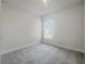 Cozy bedroom with a window and carpet flooring at 3696 Sagefield Dr, St Cloud, FL 34773