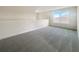 Large bonus room with a window and carpet flooring at 3696 Sagefield Dr, St Cloud, FL 34773