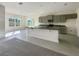 Modern kitchen with grey cabinets, granite countertops, and an island at 3696 Sagefield Dr, St Cloud, FL 34773