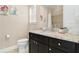 Bathroom with granite countertop and walk-in shower at 860 Desert Mountain Ct, Reunion, FL 34747