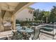 Outdoor patio with dining area, grill, and pool access at 860 Desert Mountain Ct, Reunion, FL 34747