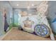 Another bedroom with Frozen mural and carriage bunk bed at 860 Desert Mountain Ct, Reunion, FL 34747