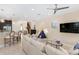 Open living room, spacious layout, featuring a large sectional sofa and kitchen island at 860 Desert Mountain Ct, Reunion, FL 34747