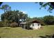 A charming light-colored cottage on a large lot with ample yard space at 1879 Lake Emma Rd, Longwood, FL 32750