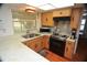 Bright kitchen features ample counter space, stainless steel appliances, and wood cabinets at 1879 Lake Emma Rd, Longwood, FL 32750