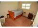 Cozy bedroom with wood-framed bed and neutral carpeting at 1879 Lake Emma Rd, Longwood, FL 32750