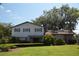 Two-story house with brick and siding, landscaping, and a large yard at 1879 Lake Emma Rd, Longwood, FL 32750
