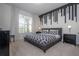 Spacious bedroom with large window and stylish wall decor at 7049 Oakwood St, Davenport, FL 33837