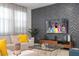 Living room features a large TV, comfortable seating, and stylish decor at 7049 Oakwood St, Davenport, FL 33837