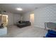 Spacious game room with comfortable seating and stylish wall decor at 7049 Oakwood St, Davenport, FL 33837