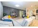 Spacious living room with sectional sofa and large TV at 7049 Oakwood St, Davenport, FL 33837