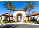Inviting community entrance with archway and lush landscaping at 7049 Oakwood St, Davenport, FL 33837
