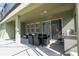 Covered patio with seating area and built-in grill at 7049 Oakwood St, Davenport, FL 33837