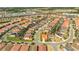 Aerial view of the community with many homes at 7049 Oakwood St, Davenport, FL 33837
