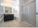 Clean bathroom with soaking tub and glass shower at 7049 Oakwood St, Davenport, FL 33837