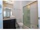 Clean bathroom with granite vanity, shower, and toilet at 7049 Oakwood St, Davenport, FL 33837