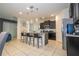 Island kitchen with dark cabinetry and pendant lighting at 7049 Oakwood St, Davenport, FL 33837